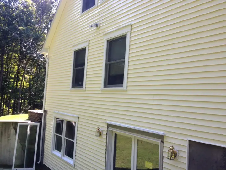 Yellow siding mold is gone after house washing